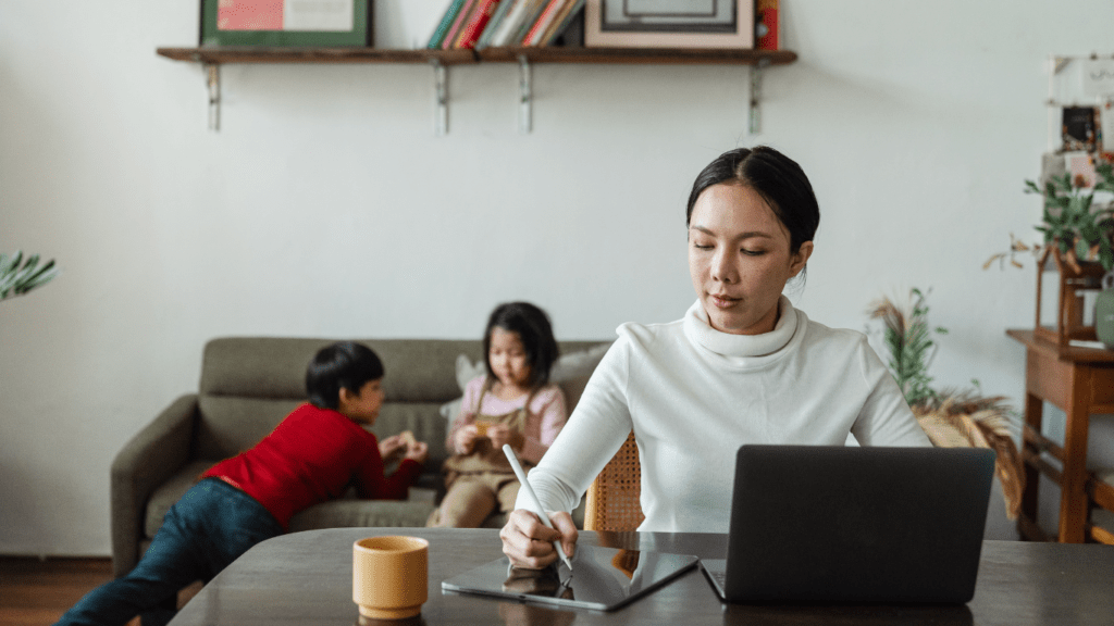 Mom is Working while kids are playing 