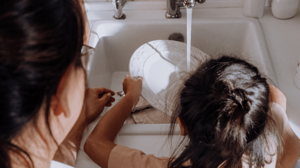 Kid washing dishes 