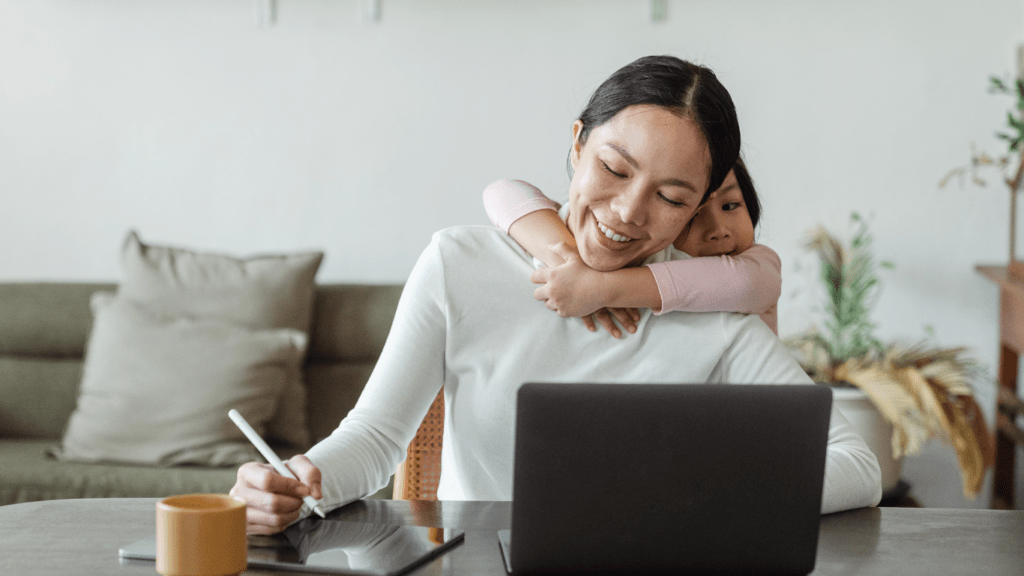 Mom using ipad and laptop to organize daily routine